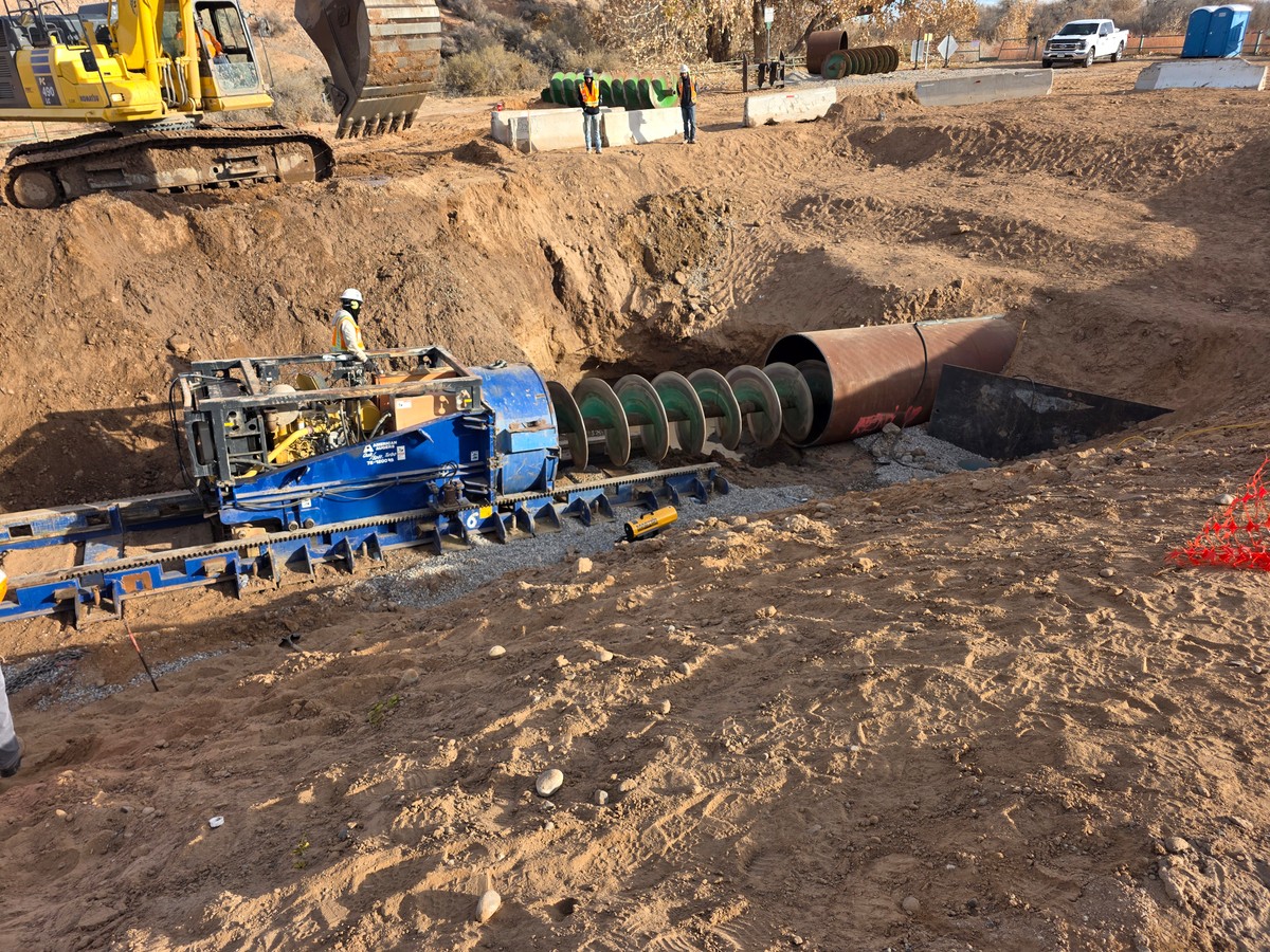 Corrales Siphon Project - Casing install augering Workers drilling a tunnel for the Corrales Siphon Replacement Project
